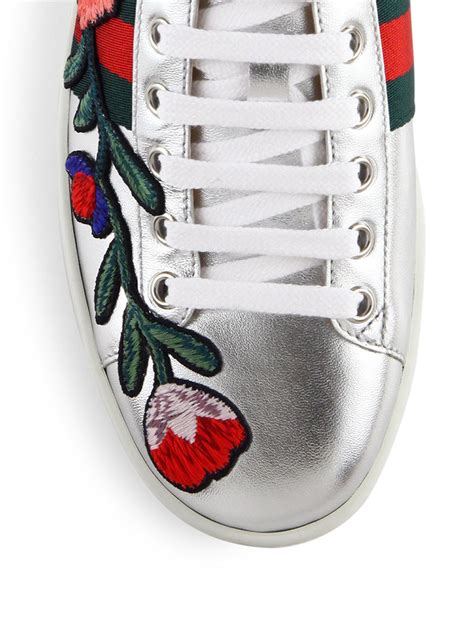 black gucci sneakers with flowers|Gucci ace embellished leather sneakers.